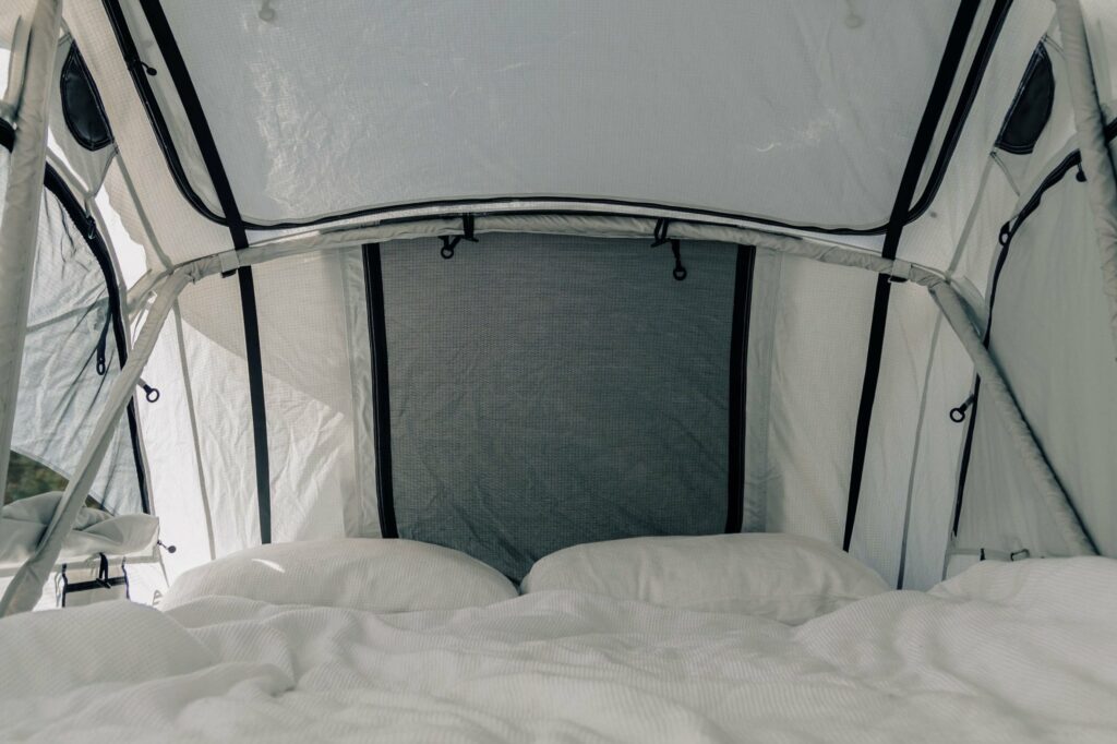 Interior of Latitude Pioneer roof tent showing 60mm high density foam mattress and stargazing windows