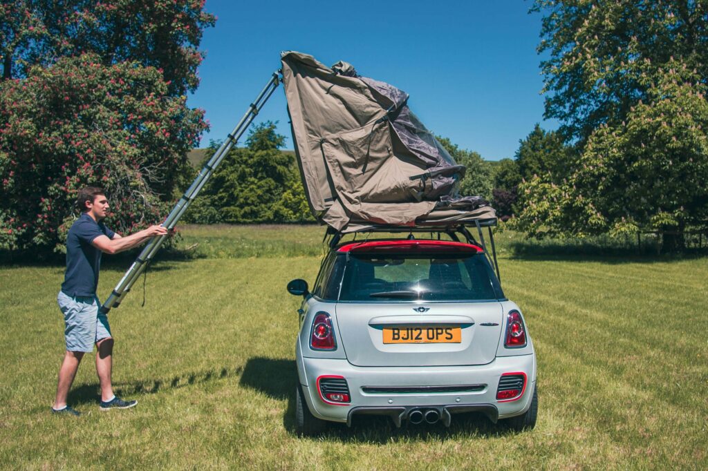 Setting up a Latitude Pioneer roof tent with stainless steel hinges and telescopic ladder